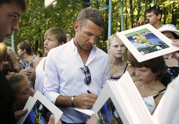 Ukrainian striker Shevchenko signs autographs during his visit to the Volodarskaya boarding-school in the Kiev region