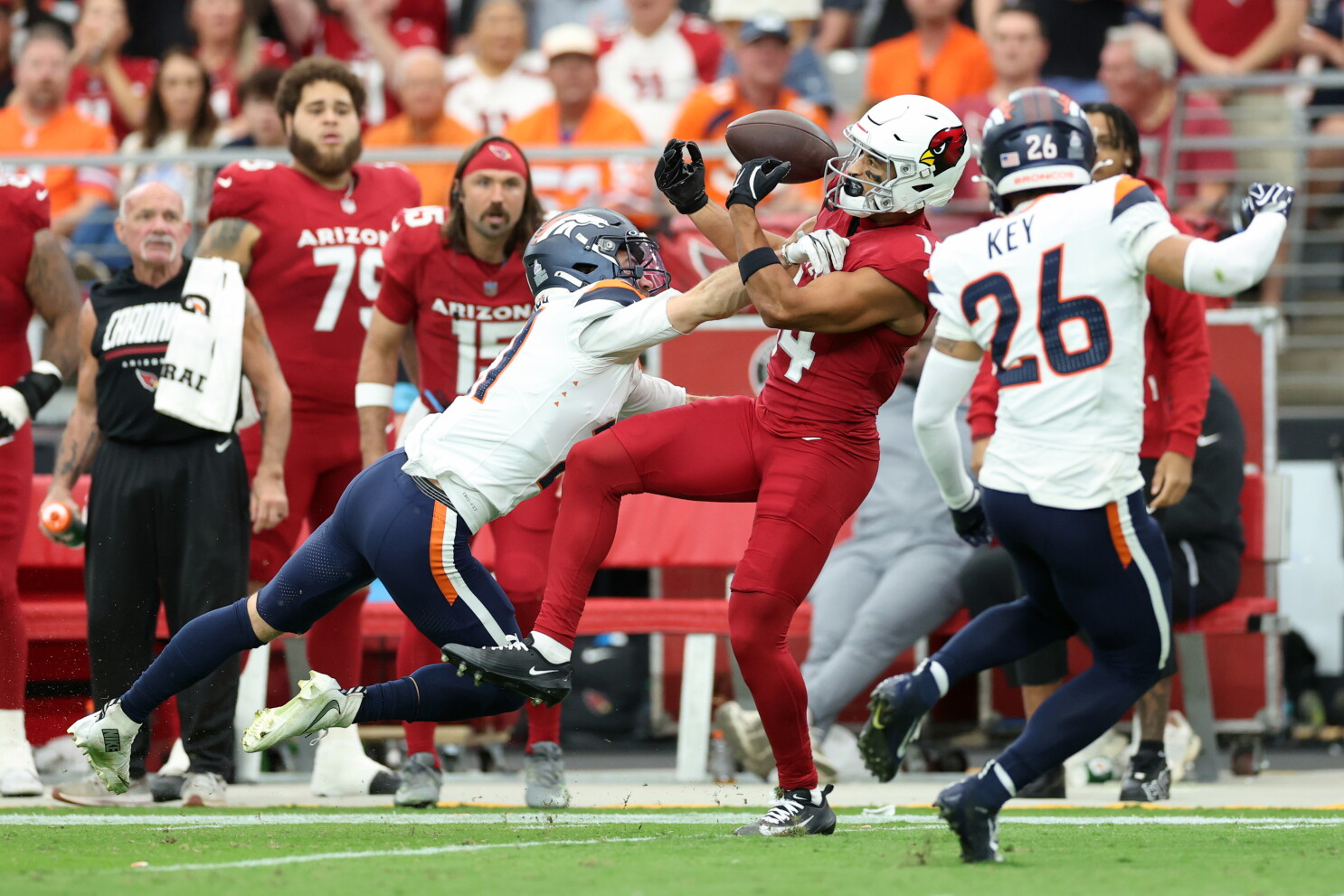 Broncos up 13-6 at halftime in Arizona