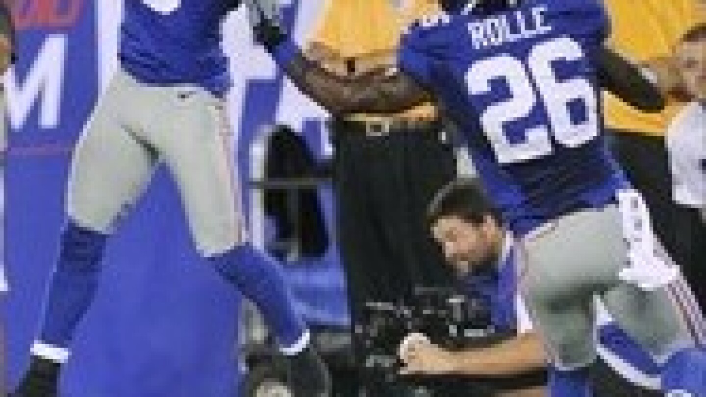 Antrel Rolle injures knee in collision with TV camera - NBC Sports