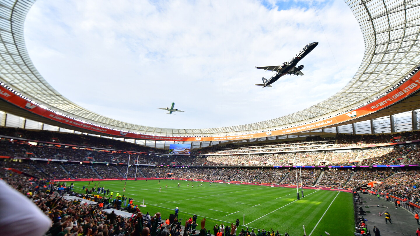 Dramatically low flyby by passenger jets over packed South African stadium sparks safety debate