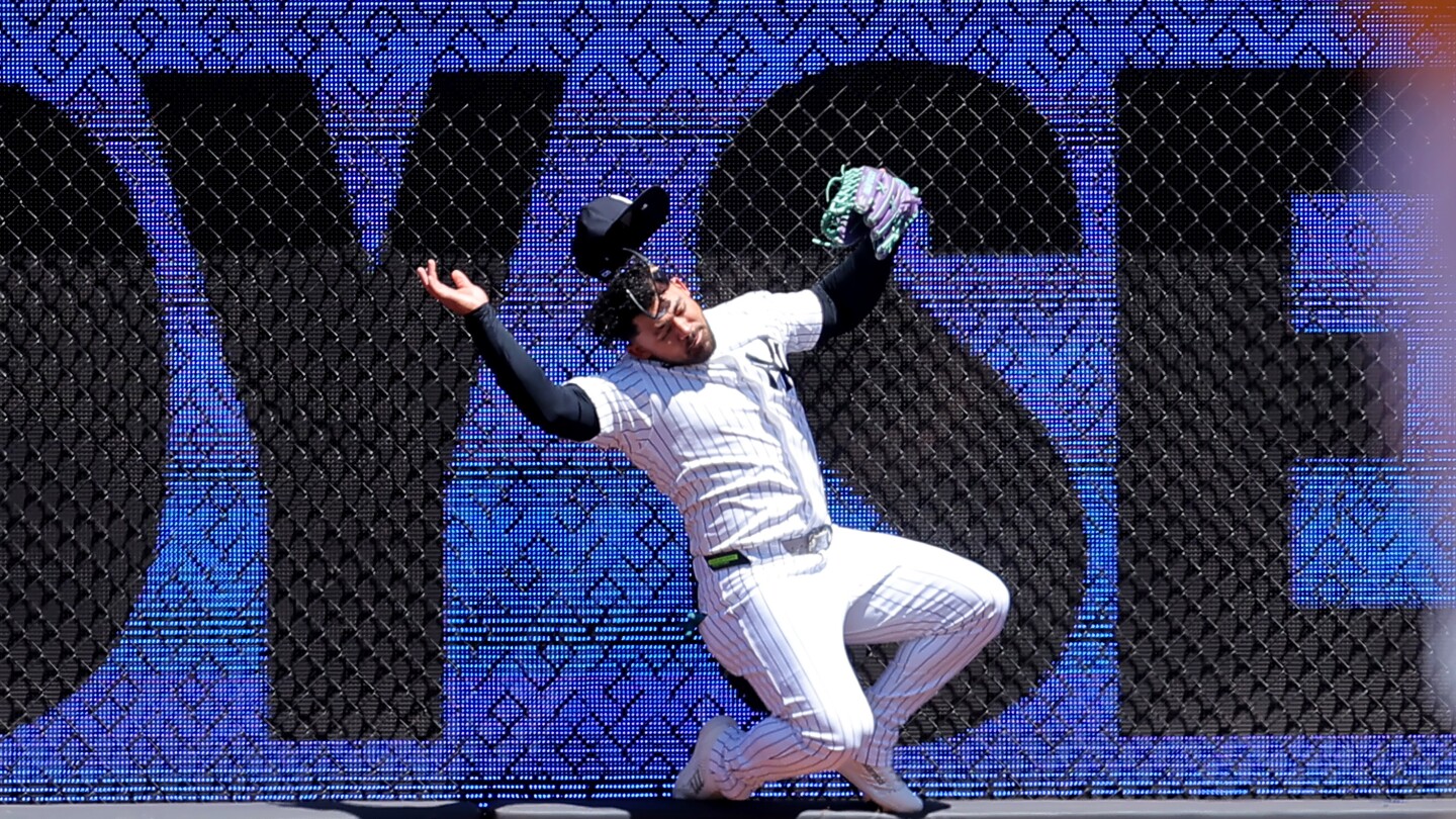 Yankees’ Jasson Domínguez leaves game after crashing into left-field wall catching leadoff drive